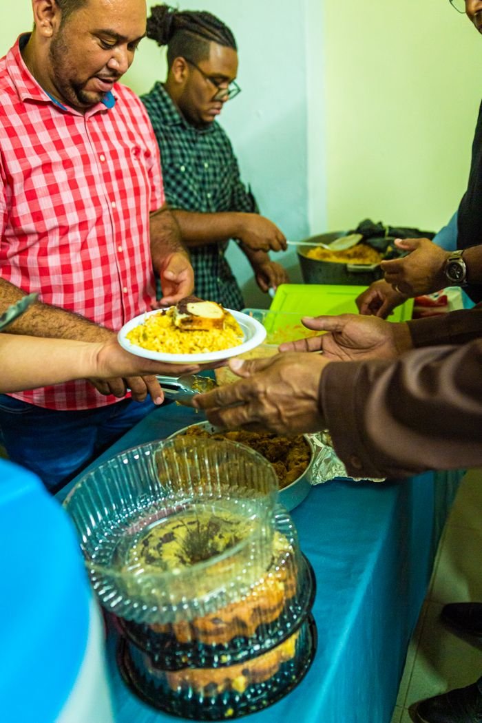 Crafting Captivating Headlines: Your awesome post title goes here Volunteers serving warm meals at a community event, focusing on togetherness and charity.